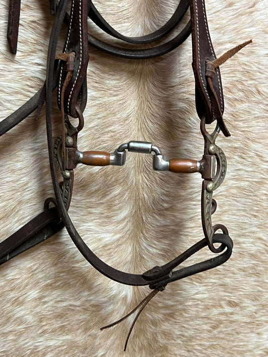 Used One Ear Bridle With Split Reins and Argentine Engraved Square Port Correctional Bit with Copper Rollers